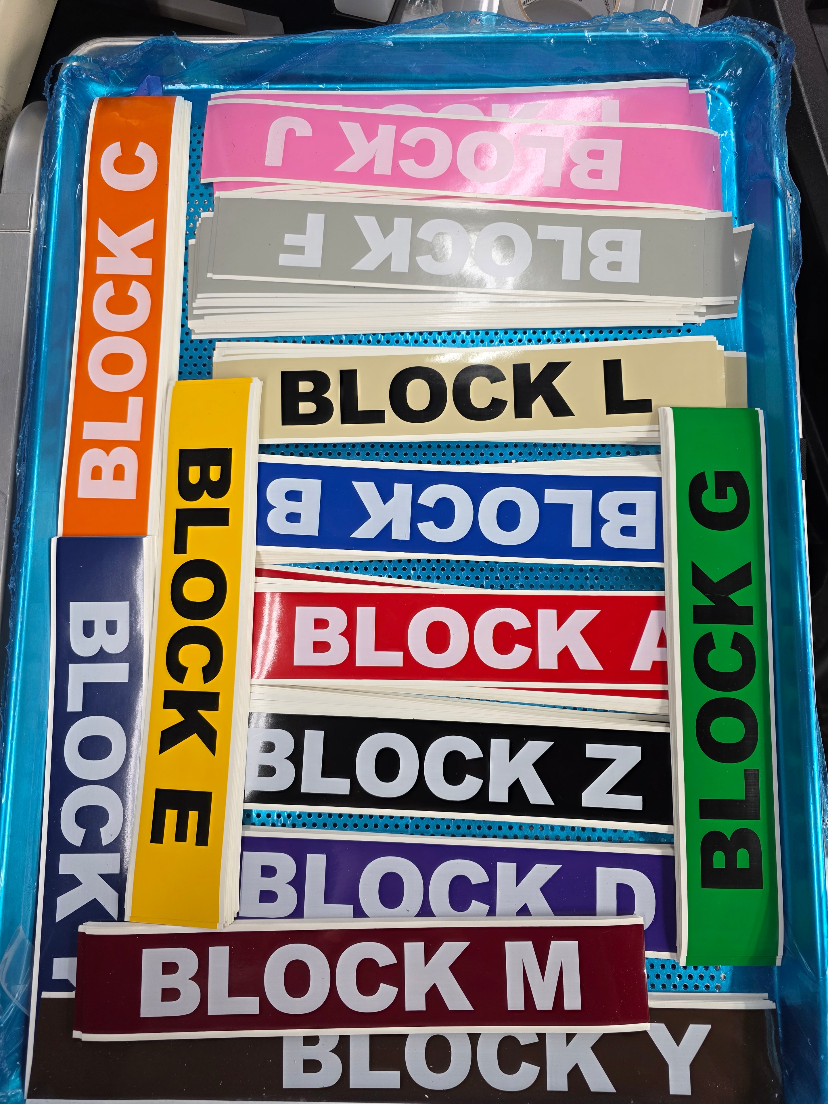 Colorful engraved block identification labels — Block A through Y