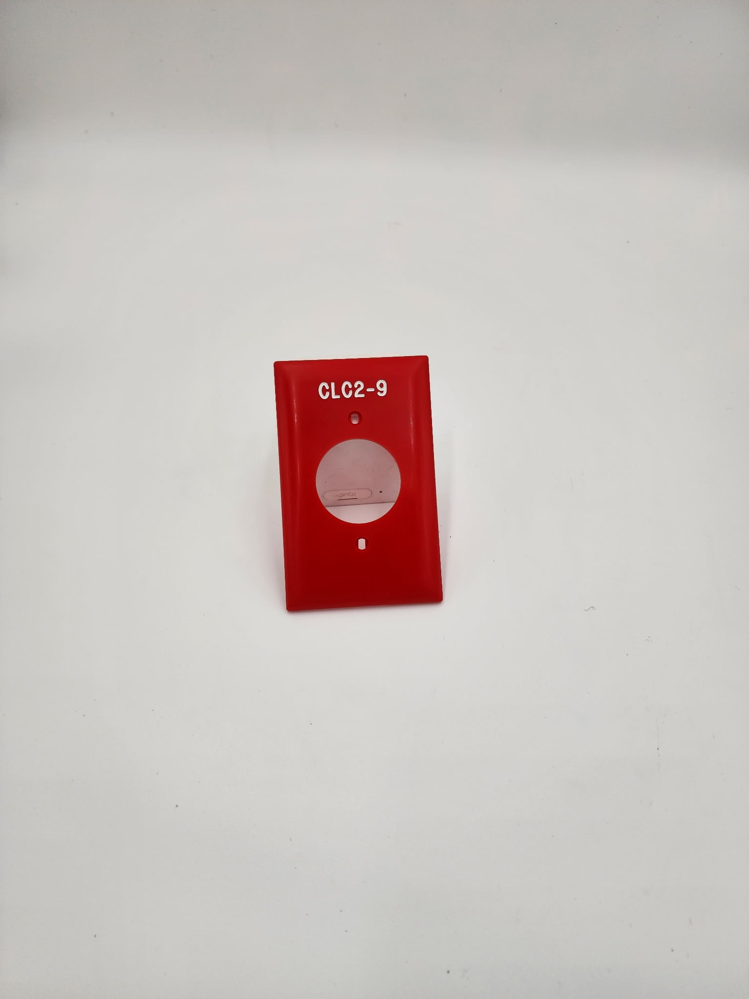 Red engraved outlet cover labeled CLC2-9